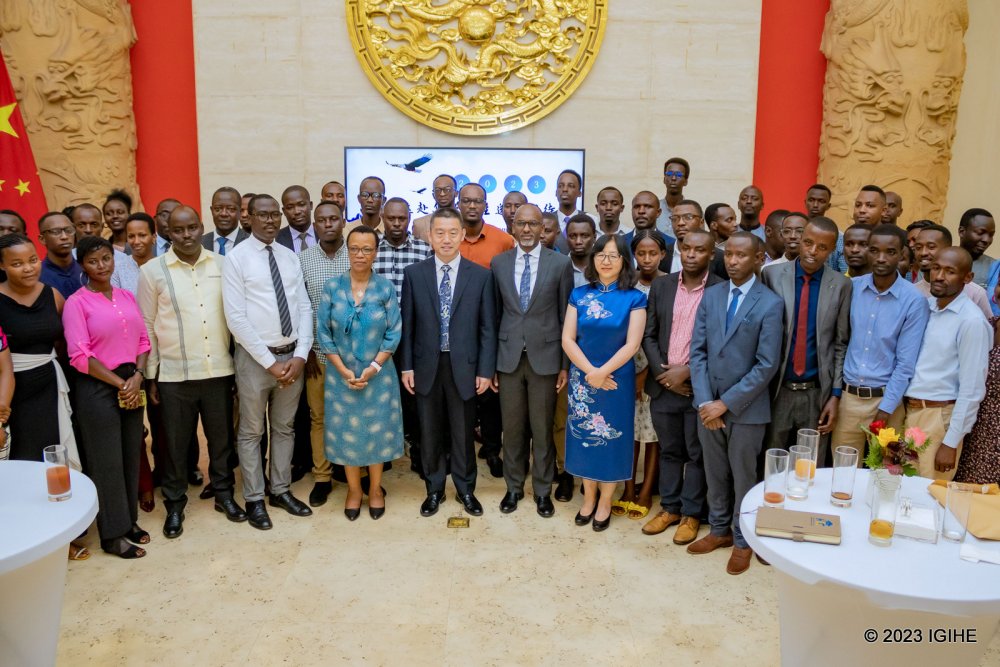 Students in a group photo with officials at the farewell ceremony. 