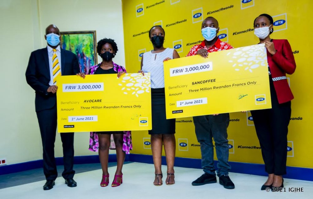 Winners receiving dummy cheques.