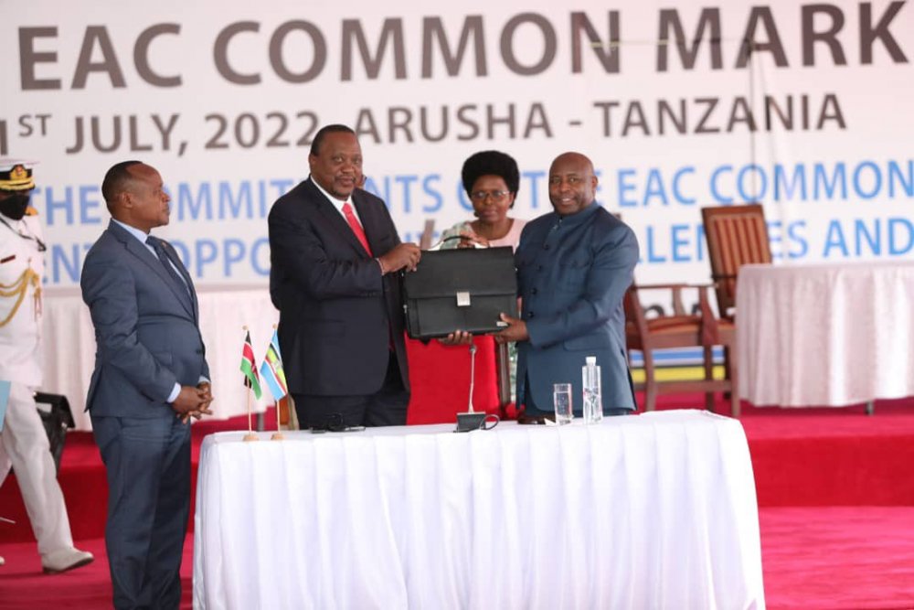 President Uhuru Kenyatta handing over the chairmanship of EAC to his counterpart of Burundi. 