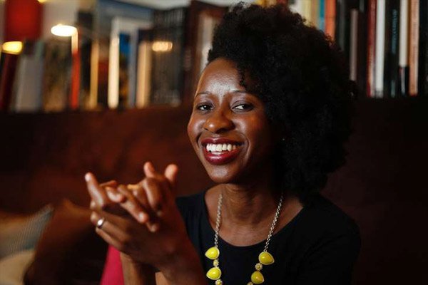 This file photo taken on July 05, 2016 shows Cameroonian author Imbolo Mbue posing in Paris. The history of Cameroonian novelist Imbolo Mbue, born 33 years ago in a house without running water and become famous overnight by getting a million dollars head for her first novel, looks like New Yorker a fairy tale.