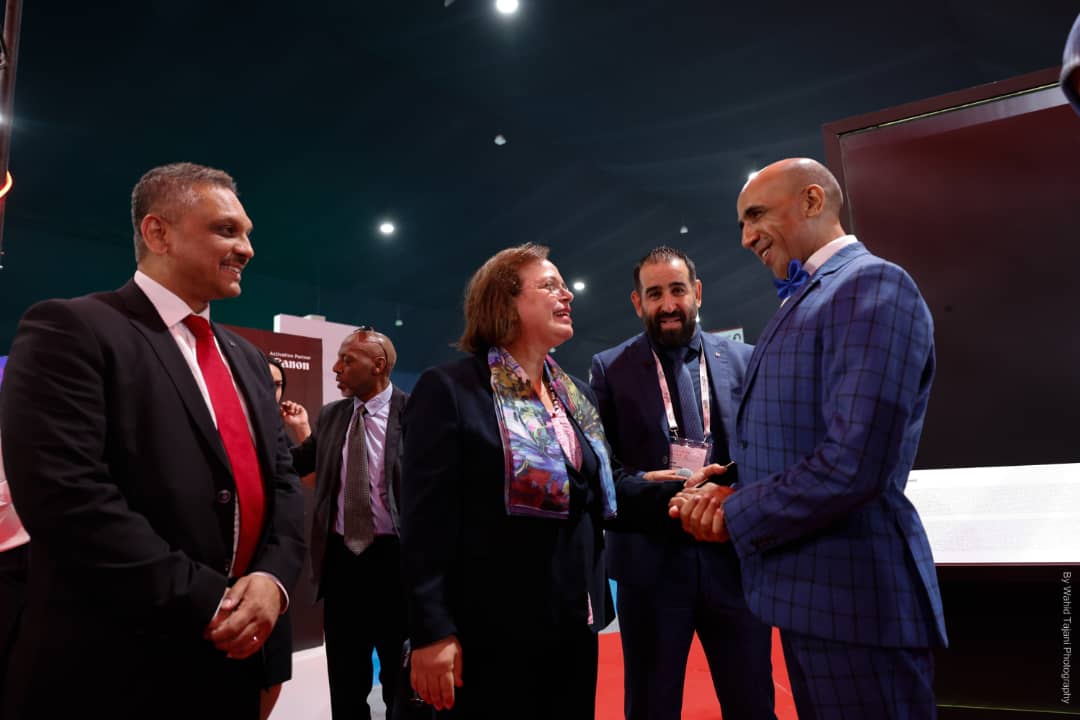 Aawatif Hayar, the Minister of Solidarity, Social Integration and Family of Morocco, exchanges pleasantries with Hamid Nabil at the expo.