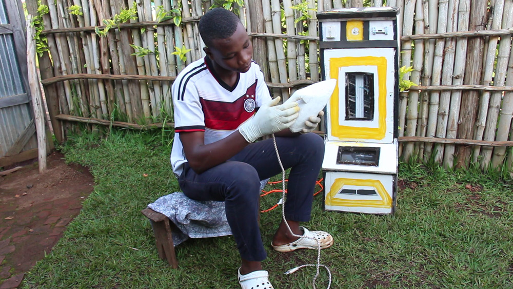 Niyigena Théogène uses old metals, wood, and other materials to make flat-irons for pressing clothes and machines that brood and hatch eggs.