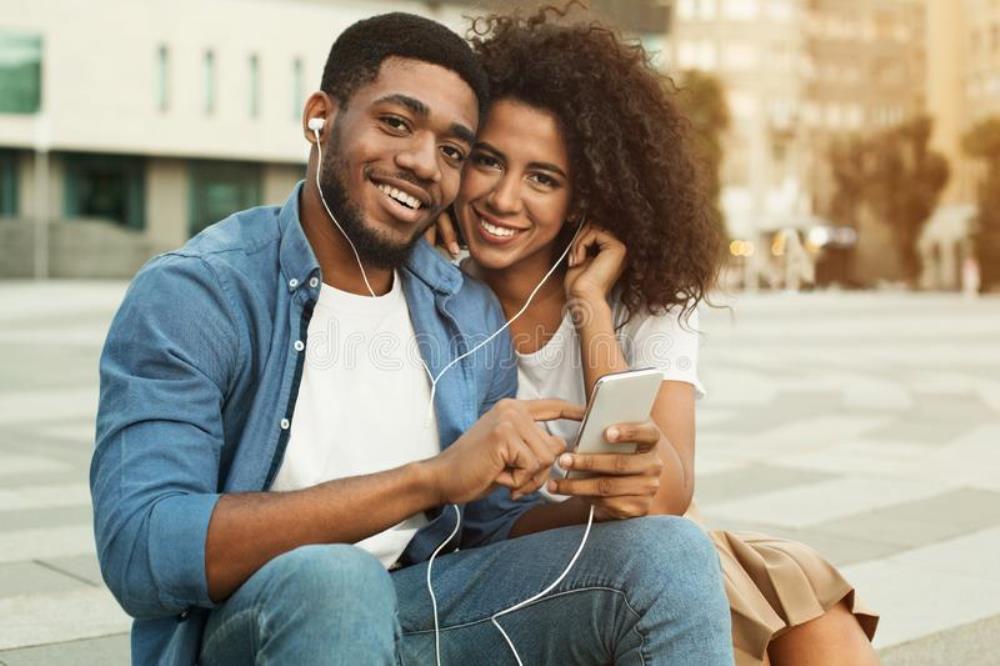 Couple enjoying music.  Photo Dreams Time