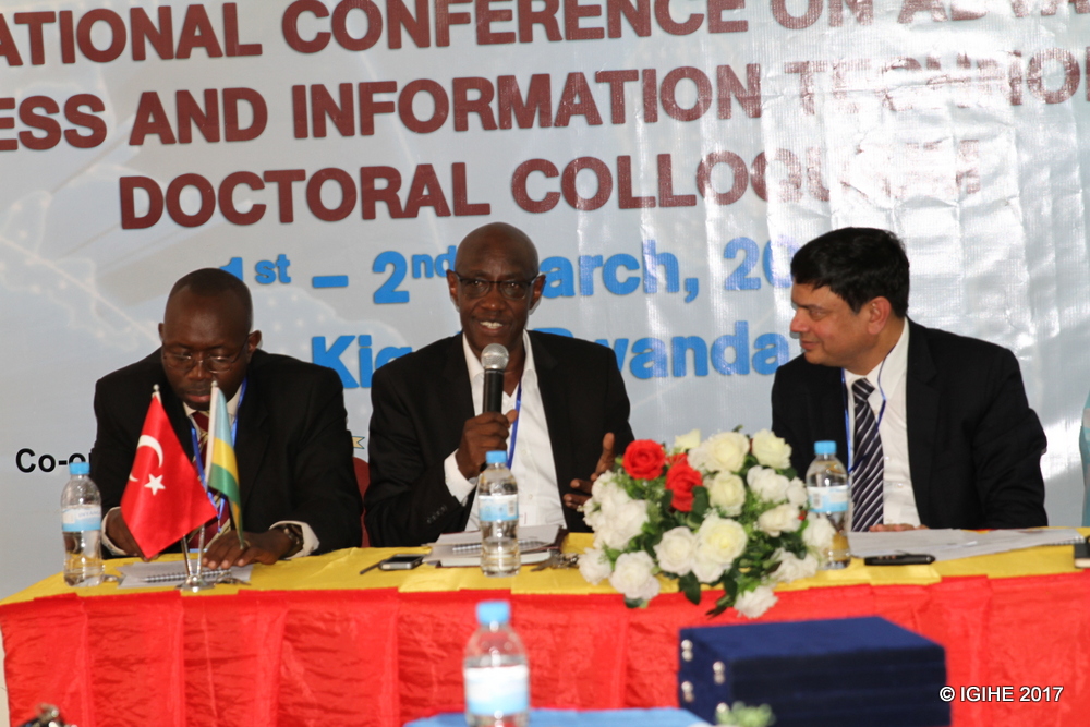 Afrika Philbert, the Chairman Board of Directors at Kigali University in the middle during the meeting yesterday.