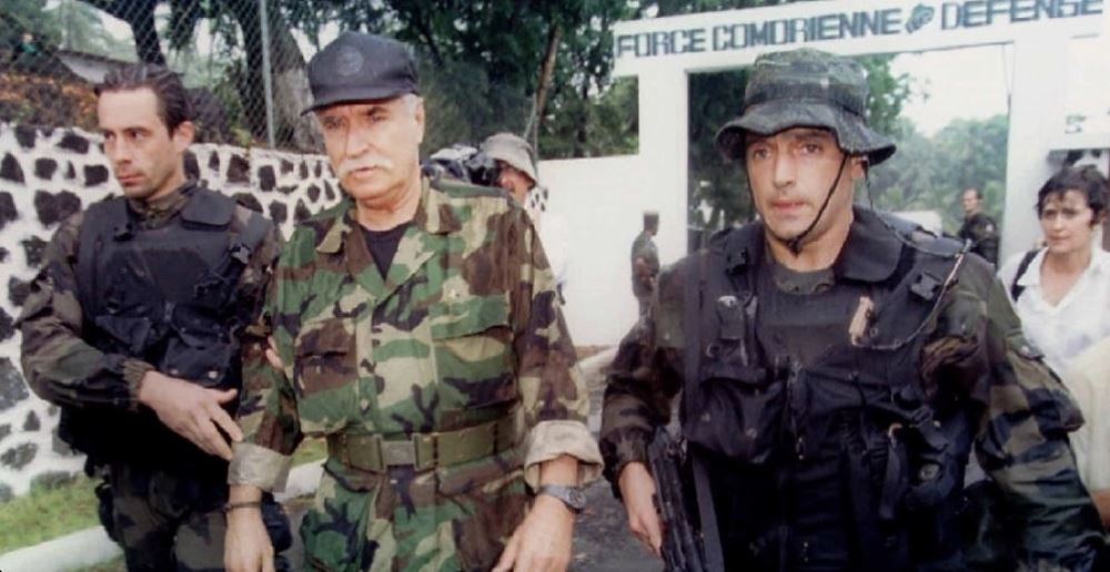 It is said that Denard (in the middle) used to send his subordinates to Rwanda during the 1994 Genocide against Tutsi in Rwanda.  