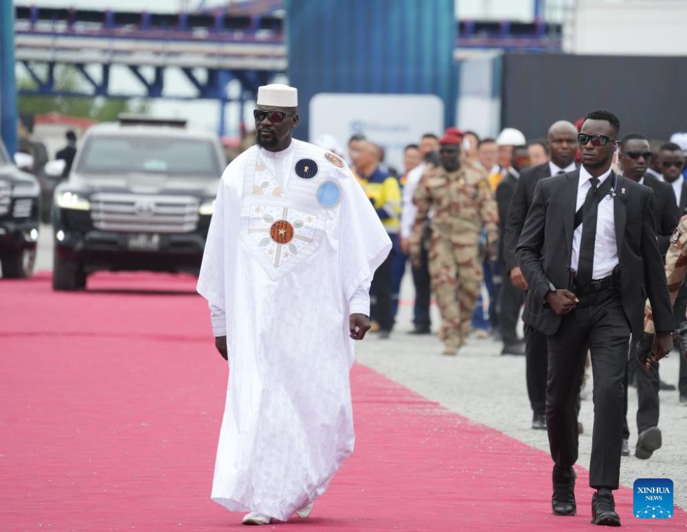 This photo taken on Nov. 11, 2025 shows Mamady Doumbouya (L) attending an official launch ceremony of the Simandou iron ore and infrastructure project held at the port of Morebaya, Forecariah Prefecture, Guinea. Guinea's transitional President Mamady Doumbouya won the presidential election held on Dec. 28, according to provisional results released Tuesday by the General Directorate of Elections.