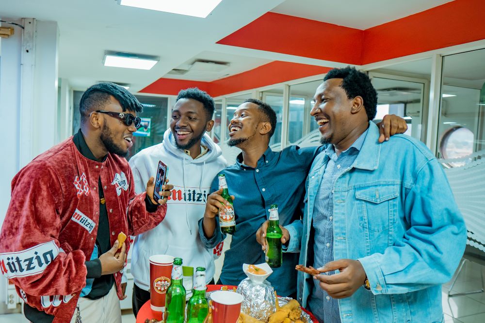 Chriss Eazy interacting with participants at the launch.