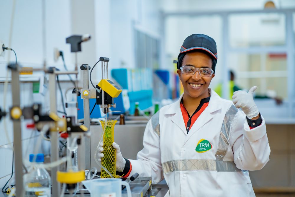 One of Bralirwa staff using a laboratory based in Nyamyumba.