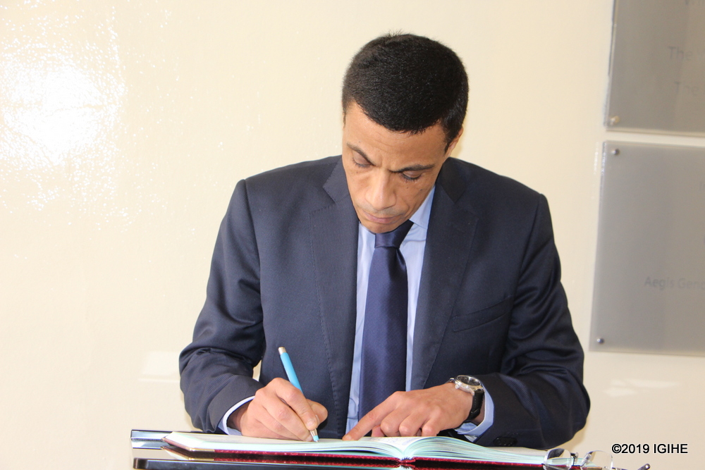 The Egyptian Ambassador Mohamed writing in the book of guests