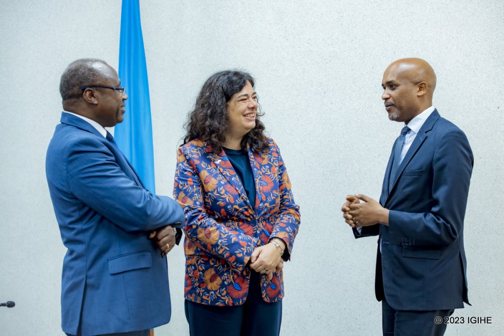 The EU Ambassador to Rwanda, Belén Calvo Uyarra (center), Minister of Finance and Economic Planning, Dr. Uzziel Ndagijimana (left), along with the Minister of Justice, Dr. Emmanuel Ugirashebuja (right) chatting after the signing of a grant agreement to reinforce Rwanda's judiciary and efforts to promote reconciliation. 