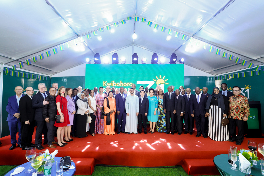 Ambassador Kimonyo poses with a diverse group of Rwandans and friends at the end of the event.