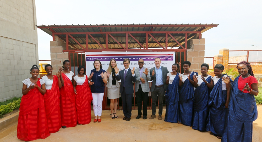 Ambassador Peter H. Vrooman poses with Masaka Creamery workers
