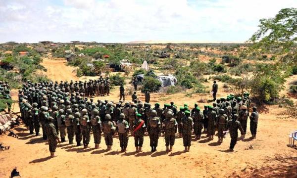 Afrian Union soldiers from Uganda being addressed by visiting Uganda's Chief of Defence Forces Gen. Katumba Wamala in the Somali town of Barawe in May 2015