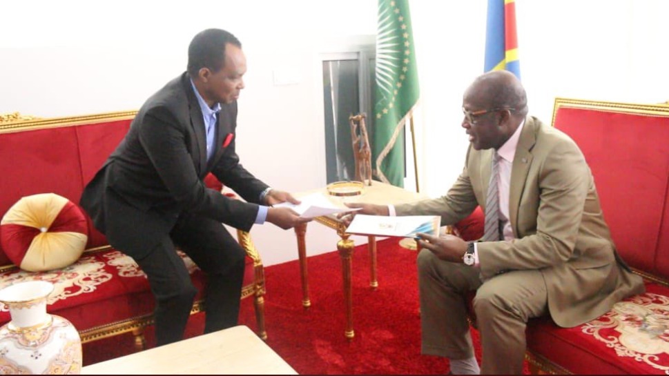 Amb. Karega receiving an expulsion letter from the Congolese Minister of Foreign Affairs. 