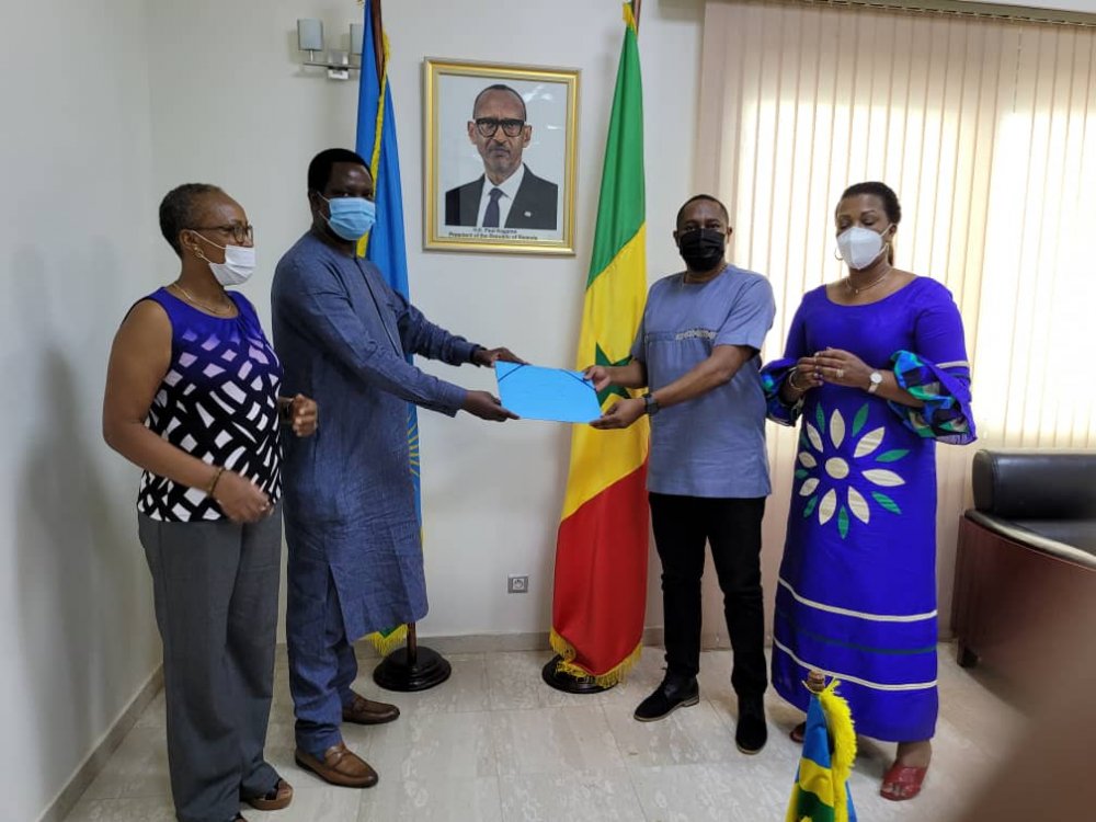 Patrick Karamaga handing over to his successor, Dr. Jovith Ndahinyuka.   