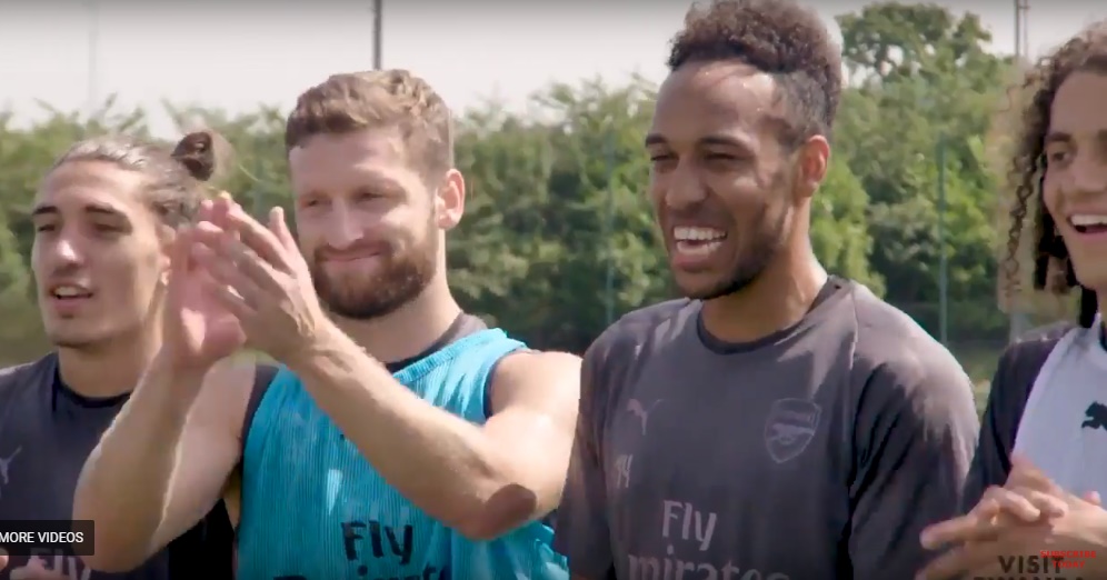 Amazed Arsenal players as they watch Rwandan drummers