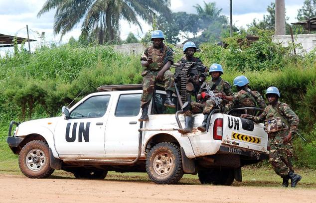 Members of MONUSCO sit on the back of a UN pick-up truck on October 23, 2014 in Beni ©Alain Wandimoyi (AFP/File)