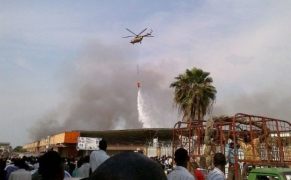 Rwandan army's helicopters were deployed to put out fire that engulfed Bujumbura market. 