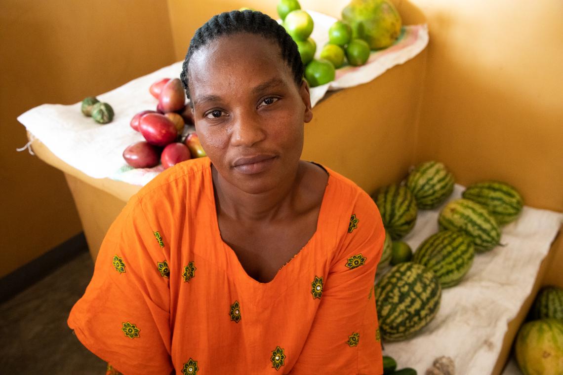 Esperance Nyiramahirwe sells fruit in the Petite Barriére market on the Rubavu-Goma border, a business that thrives on the border remaining open and relies on tight Ebola prevention measures.