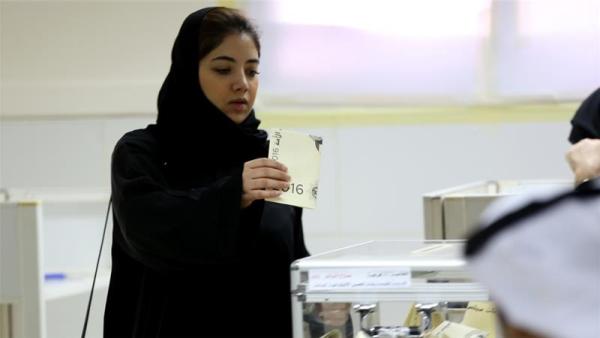 More than 290 candidates, including 14 women, are standing for 50 seats in Kuwait's parliament