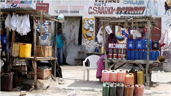 Jerry cans with petrol and motor oil are for sale on a street in Mogadishu in 2006