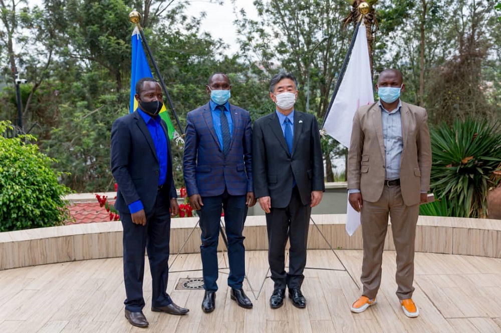Representatives from signatory organizations in a group  photo with Japan's ambassador in Rwanda.
