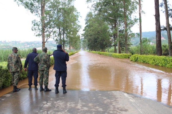 Some of security personnel inspecting the flooding