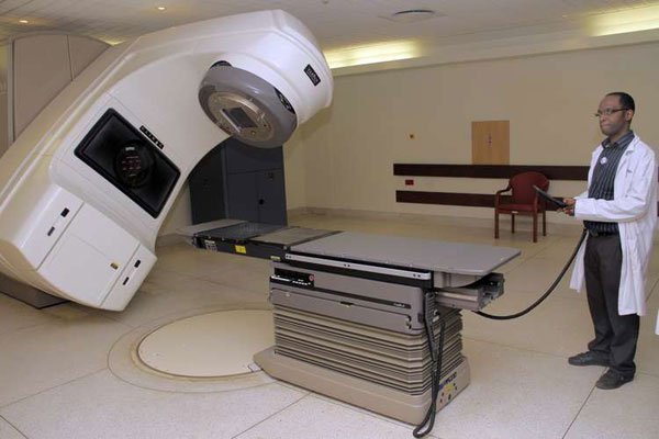 Chief Radiologist at the Aga Khan University Hospital, Stanley Rutajunara explaining how the linear accelerator machine is used in cancer treatment on January 3, 2012. Uganda’s only radiotherapy machine is broken beyond repair.