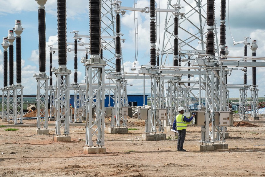 David Maina Kamore patrols at the construction site of Konza transformer substation in Machakos County, Kenya, May 5, 2023. David Maina Kamore, 32, is an electrical engineer, a profession he had been dreamed of since his childhood, at the Konza transformer substation.(Xinhua/Han Xu)