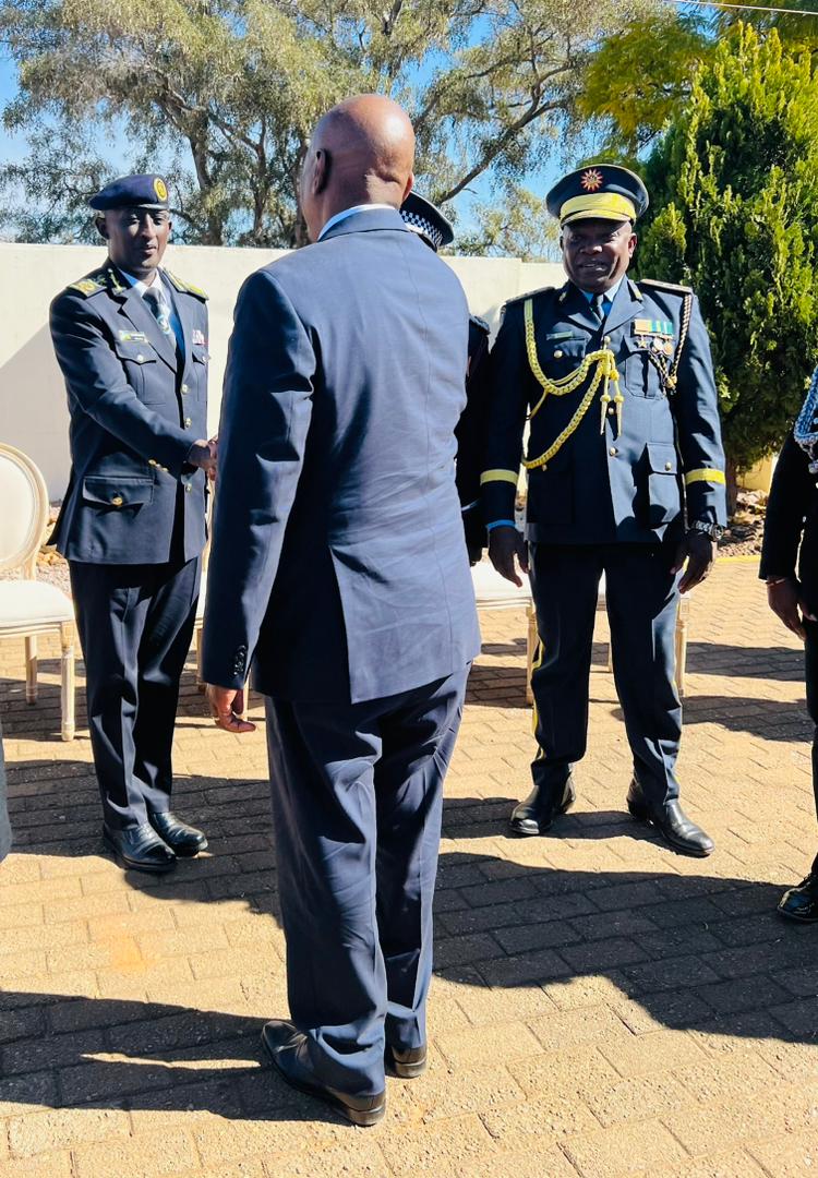 The President of Botswana, Dr. Mokgweetsi Eric Keabetswe Masisi greets IGP Felix Namuhoranye, who is in Botswana for the Police awards ceremony and anniversary.