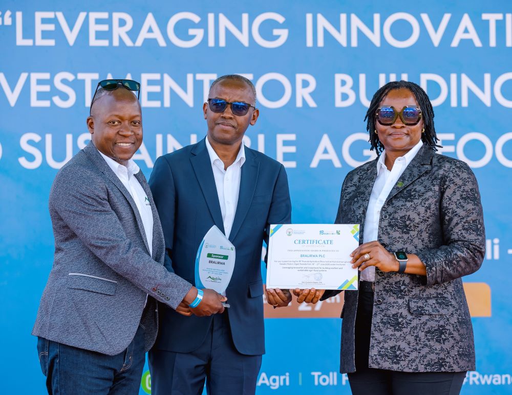 BRALIRWA Managing Director Ethel Emma-Uche and the Supply Chain Director receive award from MINAGRI at the 18th Annual Agricultural Show.