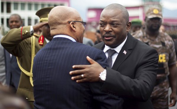Burundi's President Pierre Nkurunziza (R) embraces his South African counterpart Jacob Zuma (L) as he leaves the previous round of the Africa Union-sponsored peace dialogue in Burundi's capital Bujumbura