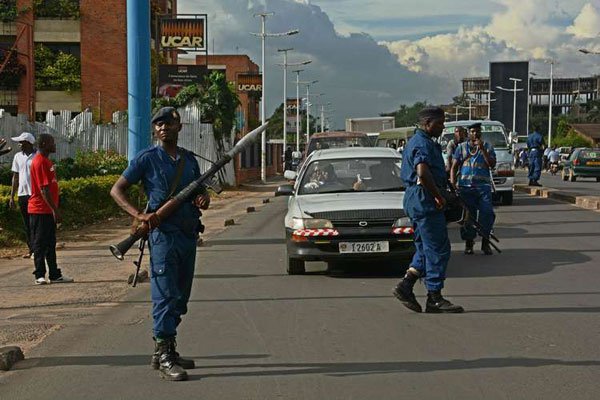Heavily armed police patrol a street in Bujumbura, Burundi, on April 12, 2016.
