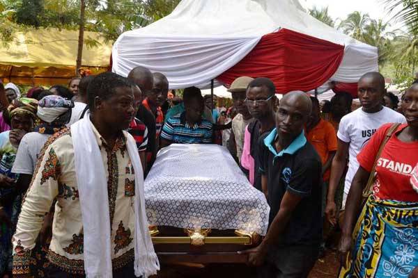 Journalists carry the casket bearing the remains of 'Standard' journalist Joseph Masha during his burial in Kolongoni Village, Kilifi County, on September 10, 2016. The journalist's father, Mzee Tondo Chiwetse, has died, just a month after the journalist collapsed and died in his house.