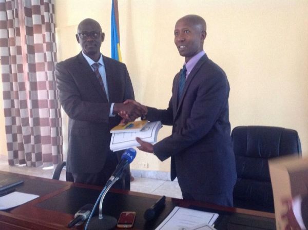The former Minister of Internal Security, Sheikh Musa Fazil Harerimana handing over responsibilities to the Minister of Justice,Johnston Busingye  