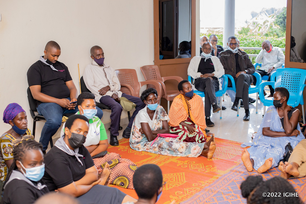The management and staff of Ubumwe Grande Hotel interacting with Genocide survivors at the center.  