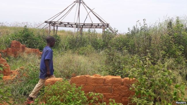 A boy walks past the ruins of the destroyed house of customary chief Kamuina Nsapu, whose death last August sparked months of deadly fighting between the government army and Kamuina Nsapu's militia in Tshimbulu near Kananga, March 11, 2017.