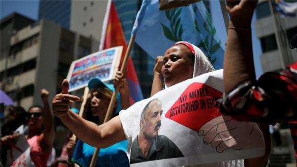 An Eritrean refugee protests against government outside EU offices in Israel
