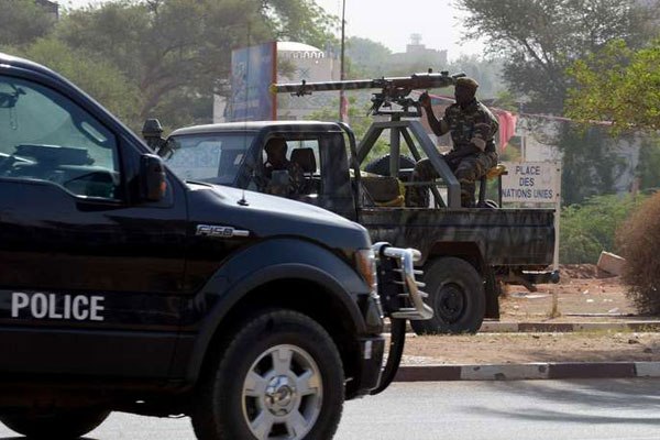 Soldiers patrol a street in Niamey during the funeral of an army chief killed by Boko Haram. A five-nation force is fighting the group.