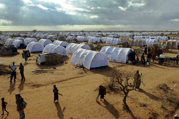 Somali refugees walking in the new Ifo extension at the Dadaab refugee camp in Kenya on July 31, 2011.