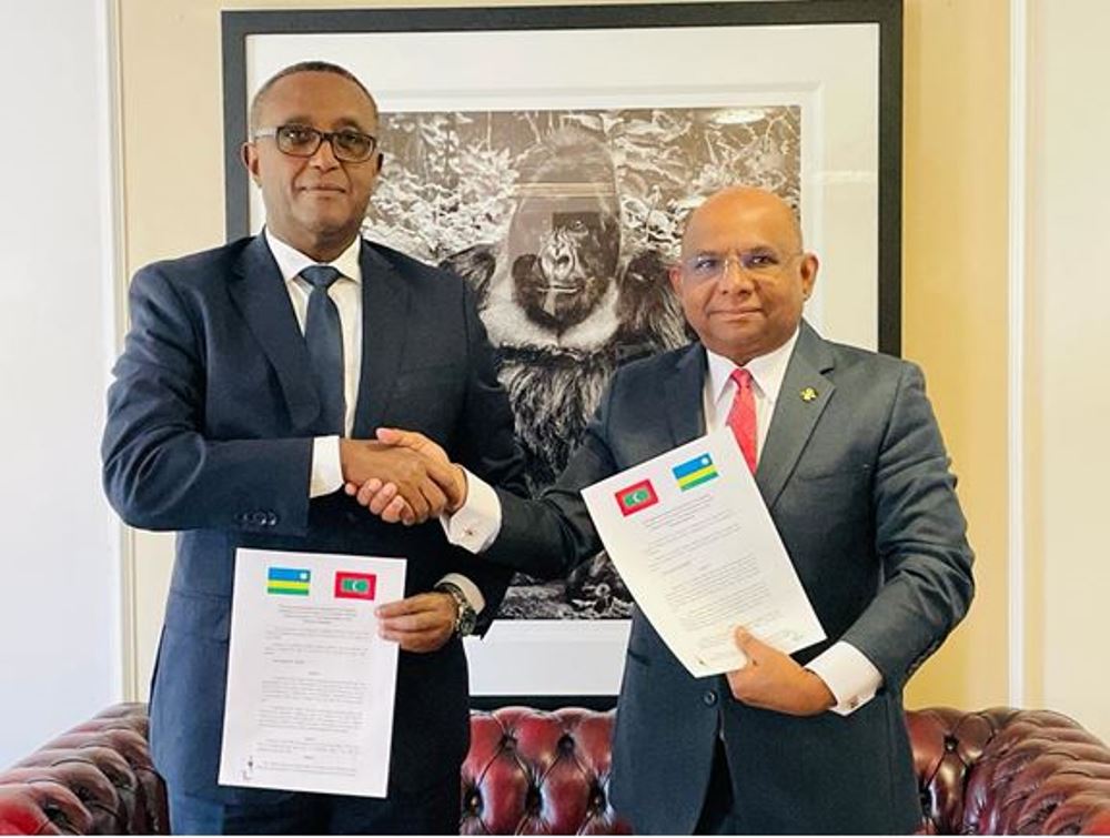 Minister Biruta and his counterpart of Maldives exchanging documents after signing the agreement. 