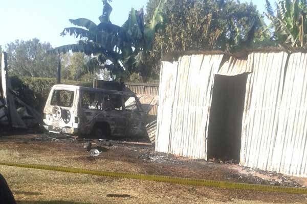 The remains of the car and store that were burnt by arsonists at the home of Nyakach MP Aduma Owuor Saturday night, September 10, 2016. Police said they were investigating the incident.