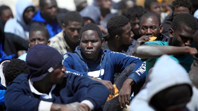 Refugees rest after being rescued by the Libyan Coast Guard at a naval post in the coastal town of Tajoura in May
