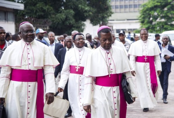 Government and opposition parties in the DR Congo emerge from the Catholic church's National Episcopal Conference of Congo, on 31 December 2016, after brokering a hard-won deal over President Joseph Kabila's fate