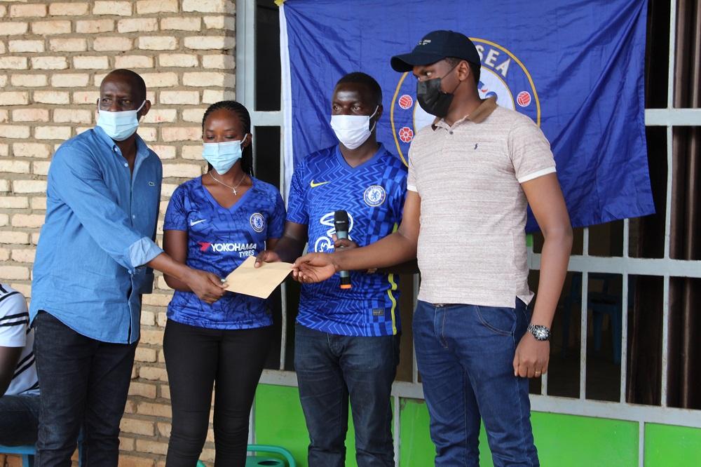 Chelsea FC fans who lent a hand in construction of the gardens also subscribed 180 residents for community based health insurance. 