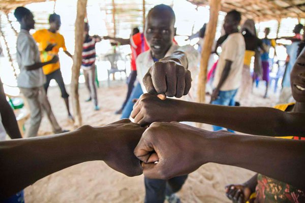 Young refugees from Sudan practice an activity on "trauma healing" at Doro refugee camp, in Maban, South Sudan, on May 3, 2017. The NGO Jesuit Refugee Service provides therapeutic activities for youth who have experienced critical experiences in conflicts, such as in the Blue Nile, in Sudan.