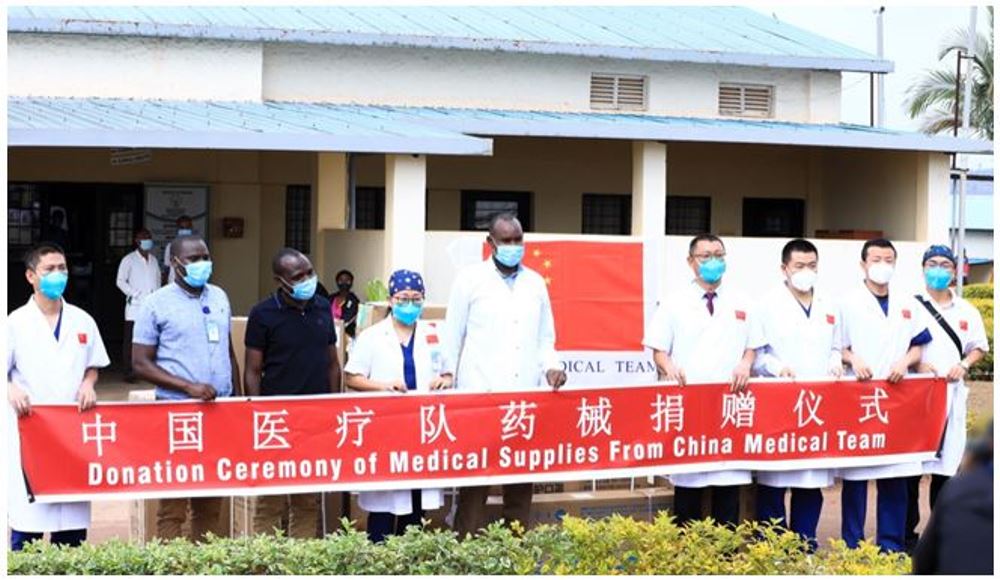 Dr. Gahima John, Director General Kibungo Hospital (middle) receiving medical supplies donated by China 21st medical team in Rwanda. Photo: Africa China Review Aug 12, 2021