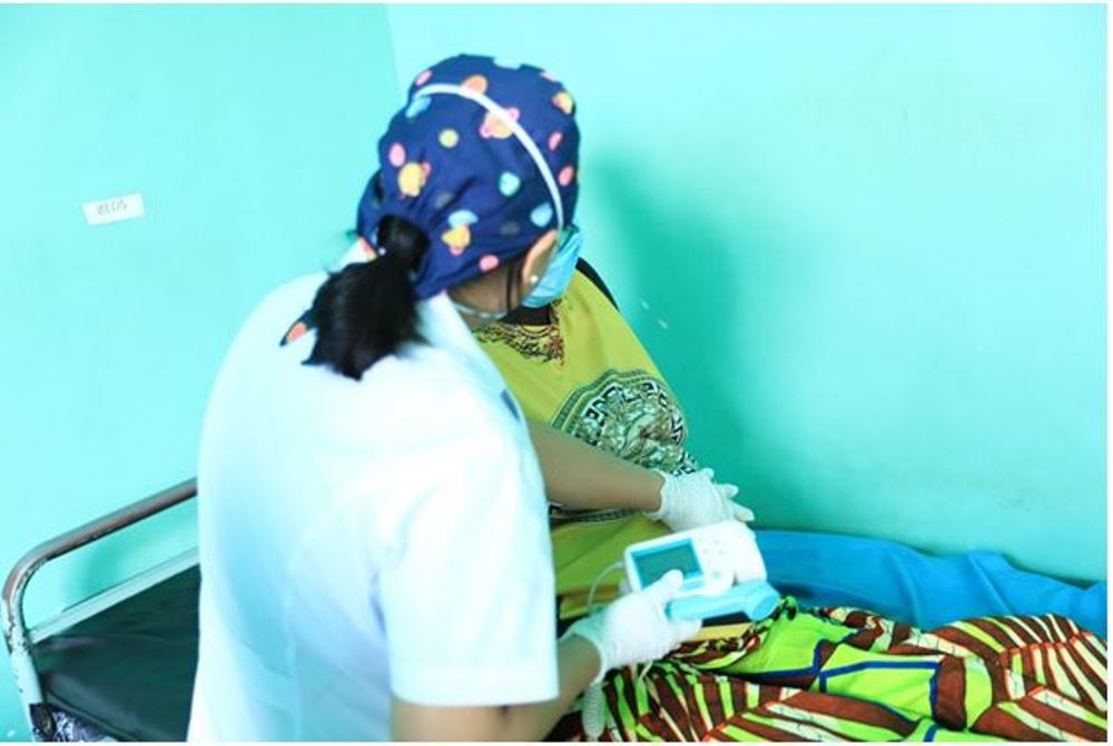 Dr. Yang Wen Hui-Gynecologist- obstetrics examining a pregnant mother at Kibungo Hospital. Dr. Yang is also the leader of the China medical team at Kibungo hospital. Photo: Africa China Review: Aug.12, 2021