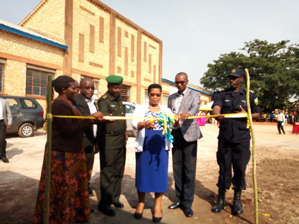 Officials cut a ribbon during the inauguration ceremony of 31 new classrooms and 36 toilets constructed around different schools across the district.