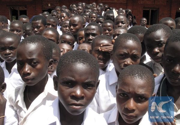 Students walk out a class room in a Burundian refugee site in western Tanzania.